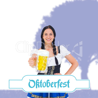 Composite image of pretty oktoberfest girl holding beer tankard