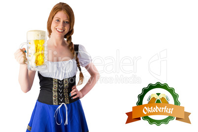 Composite image of oktoberfest girl smiling at camera holding be