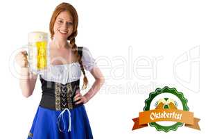 Composite image of oktoberfest girl smiling at camera holding be