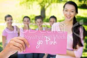 Go pink against smiling women in pink for breast cancer awarenes
