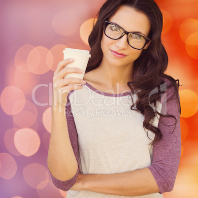 Composite image of brunette with mug