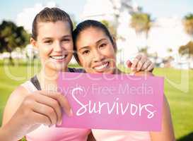 Survivors against two smiling women wearing pink for breast canc