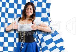 Composite image of pretty oktoberfest girl showing thumbs up