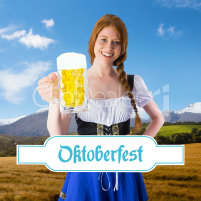 Composite image of oktoberfest girl smiling at camera holding be