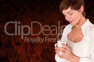 Composite image of beautiful woman holding coffee cup
