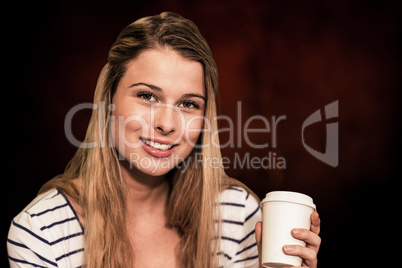 Composite image of portrait of smiling female student holding di