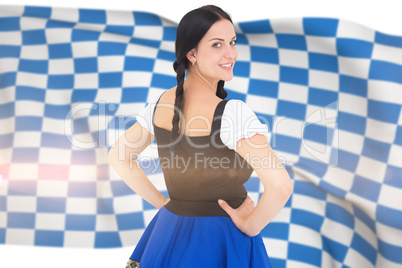 Composite image of pretty oktoberfest girl smiling at camera