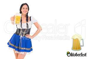 Composite image of pretty oktoberfest girl holding beer tankard