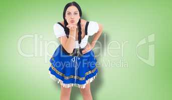 Composite image of pretty oktoberfest girl blowing a kiss