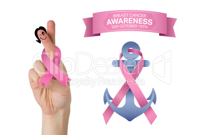 Composite image of crossed fingers with breast cancer ribbon