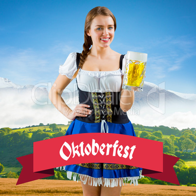 Composite image of pretty oktoberfest girl smiling at camera hol