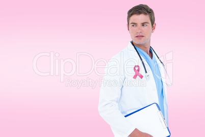 Composite image of male doctor looking away while holding clipbo