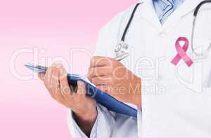 Composite image of doctor writing on clipboard