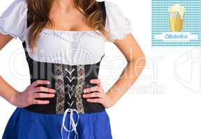 Composite image of oktoberfest girl standing with hands on hips