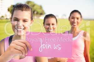 Join us against three smiling women wearing pink for breast canc