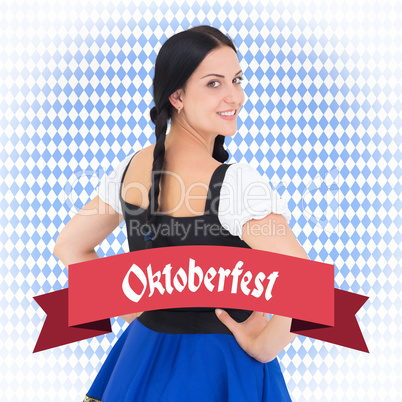 Composite image of pretty oktoberfest girl smiling at camera