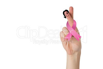 Crossed fingers with breast cancer ribbon