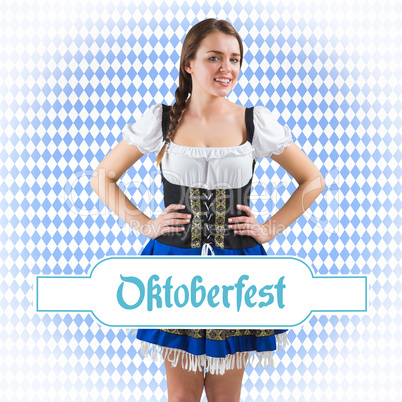 Composite image of pretty oktoberfest girl with hands on hips