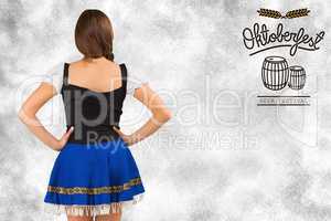 Composite image of oktoberfest girl standing with hands on hips