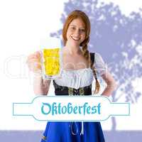 Composite image of oktoberfest girl smiling at camera holding be