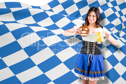 Composite image of pretty oktoberfest girl holding beer tankard