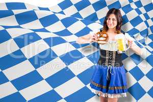 Composite image of pretty oktoberfest girl holding beer tankard