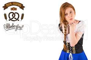 Composite image of oktoberfest girl blowing a kiss