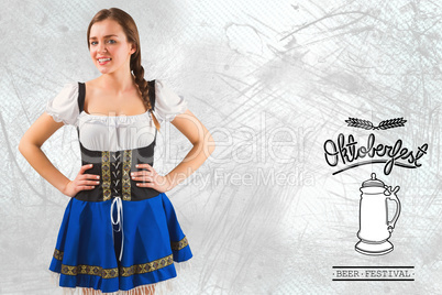 Composite image of pretty oktoberfest girl with hands on hips