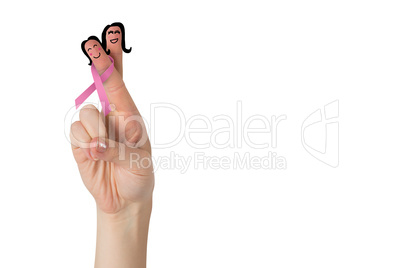 Crossed fingers with breast cancer ribbon