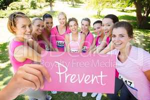 Prevent against smiling women running for breast cancer awarenes