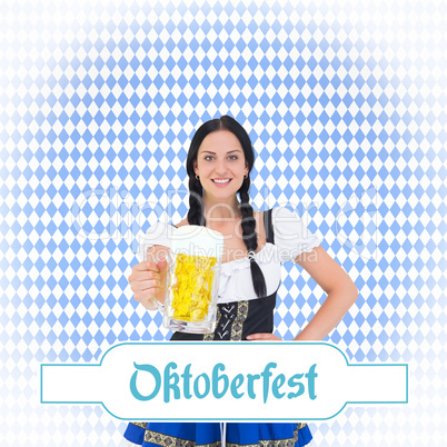 Composite image of pretty oktoberfest girl holding beer tankard