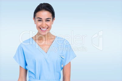 Composite image of young nurse in blue tunic