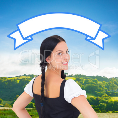 Composite image of pretty oktoberfest girl smiling at camera