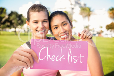 Check list against two smiling women wearing pink for breast can