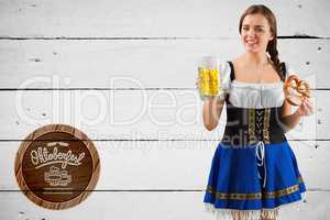 Composite image of oktoberfest girl holding beer and pretzel