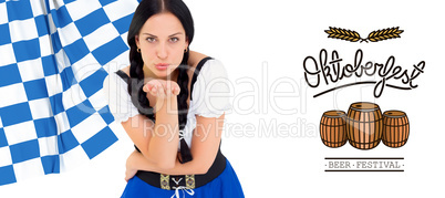 Composite image of pretty oktoberfest girl blowing a kiss