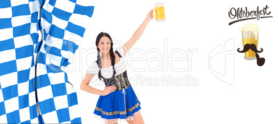 Composite image of pretty oktoberfest girl holding beer tankard