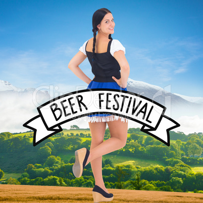 Composite image of pretty oktoberfest girl smiling at camera