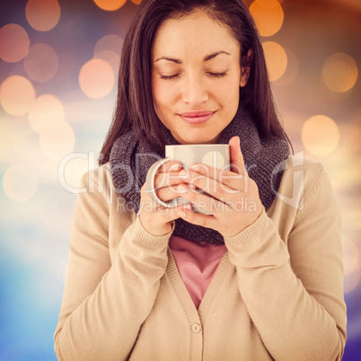 Composite image of smiling woman smelling hot beverage