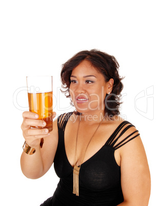 Pretty girl holding up glass of tee.