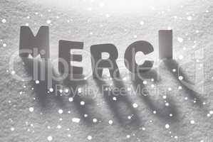 White Word Merci Means Thank You On Snow, Snowflakes