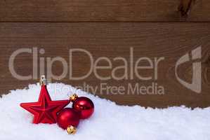 Wooden Christmas Background On Snow, Red Balls And Star