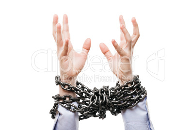 Businessman with metal chain tied hands raised for rescue help