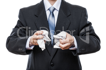 Angry businessman hand holding crumpled torn paper document