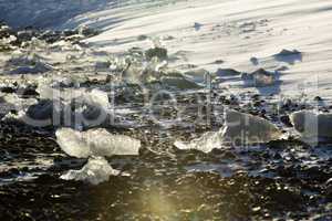 Ice blocks at glacier lagoon Jokulsarlon, Iceland in evening lig