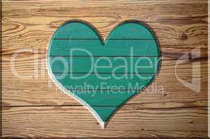 ausgesägtes Herz auf Holzbrett Tafel