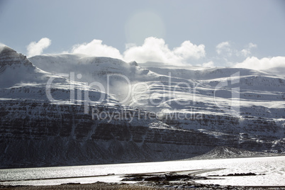 Snow-covered volcanic mountain landscape