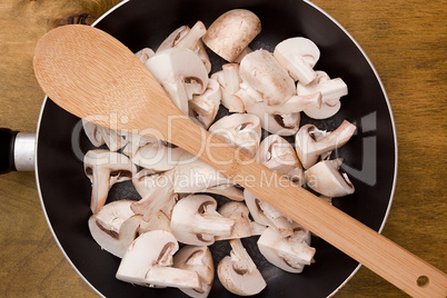 Coarsely chopped mushrooms in a frying pan