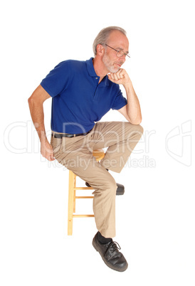 Old man sitting on chair thinking.