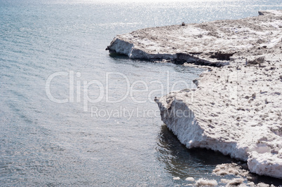 Dirty ice edge and melting floes at water